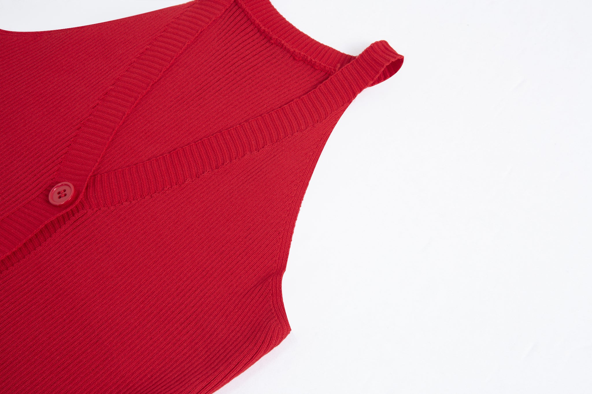 Merra Muse halter V-neck ribbed button tank with a fitted silhouette 
