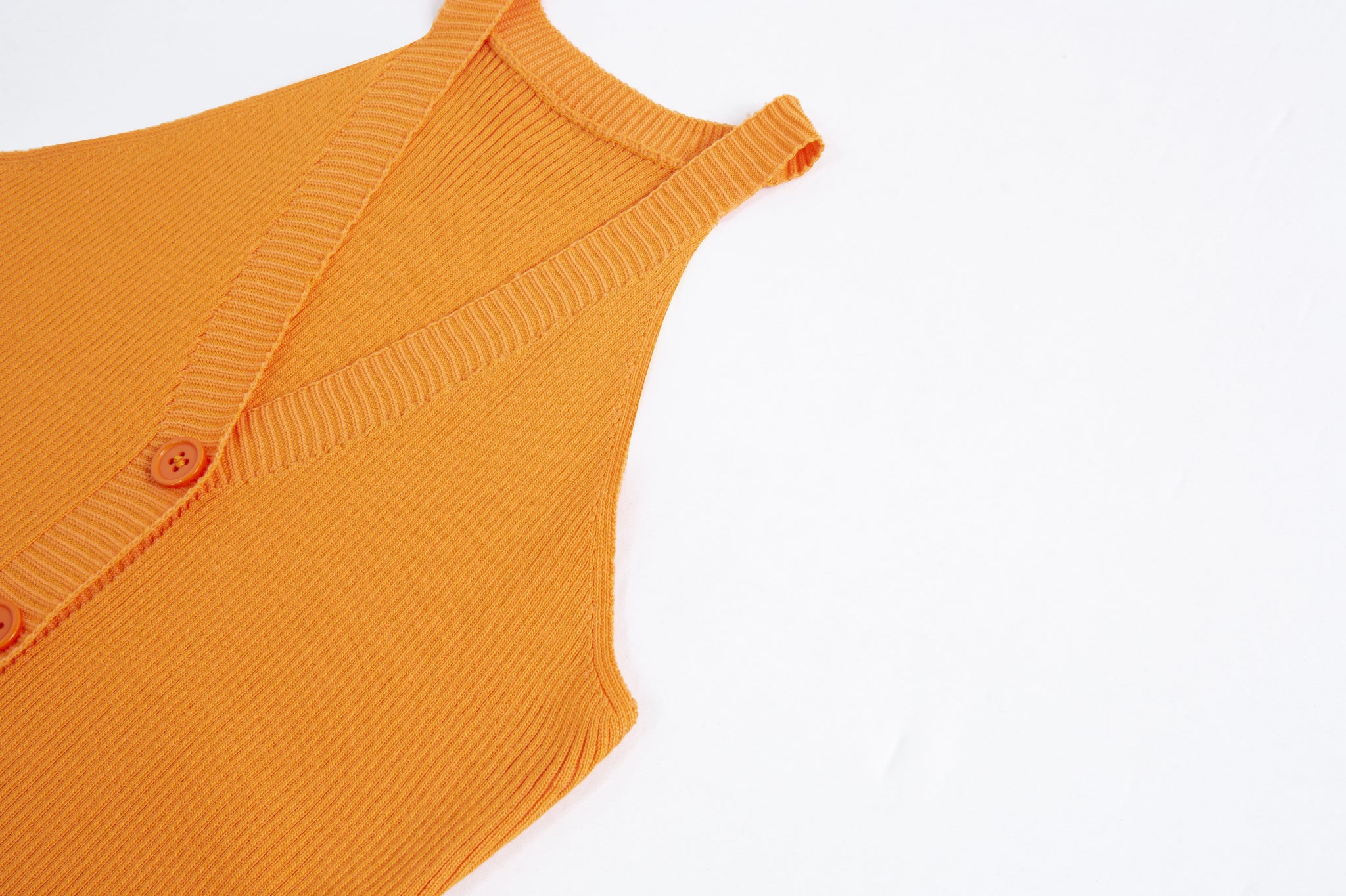 Merra Muse halter V-neck ribbed button tank with a fitted silhouette
