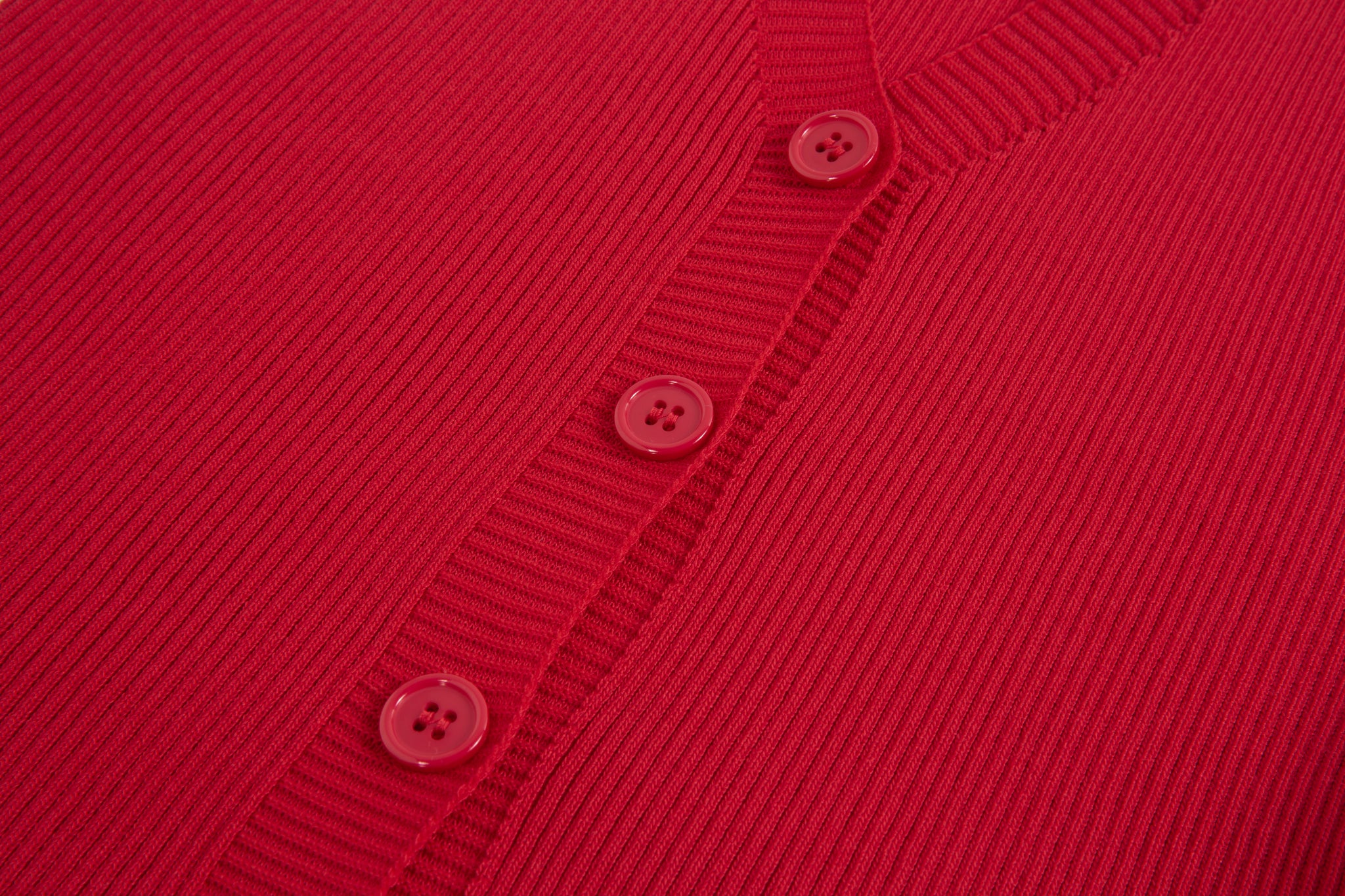 Merra Muse halter V-neck ribbed button tank with a fitted silhouette 
