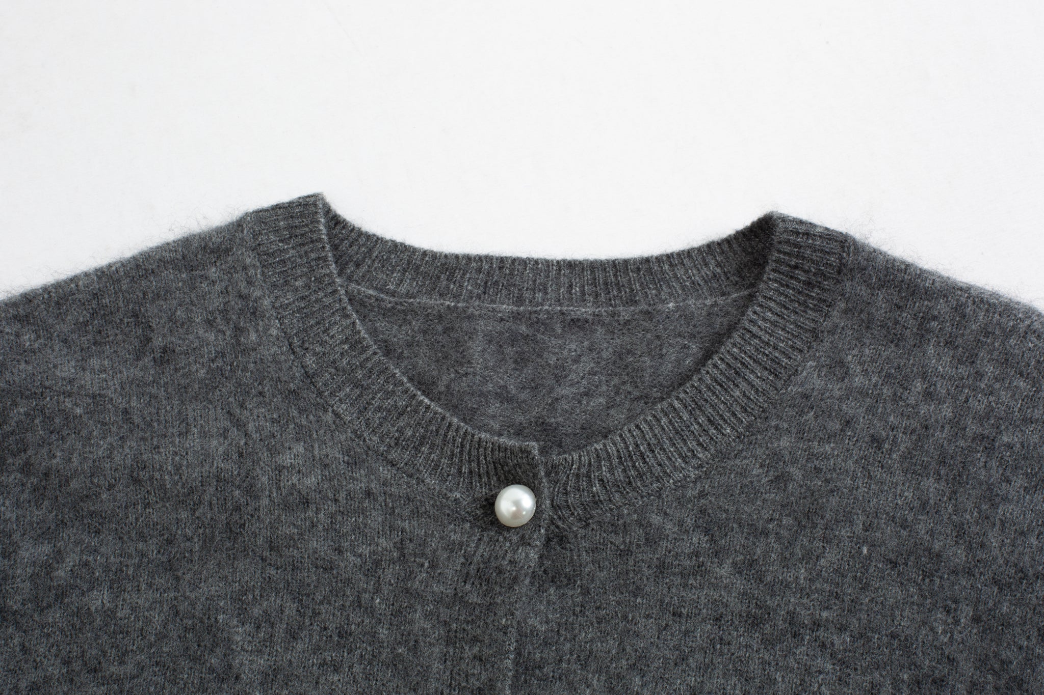 Merra Muse luxe cashmere crew cardigan with a refined, classic silhouette
