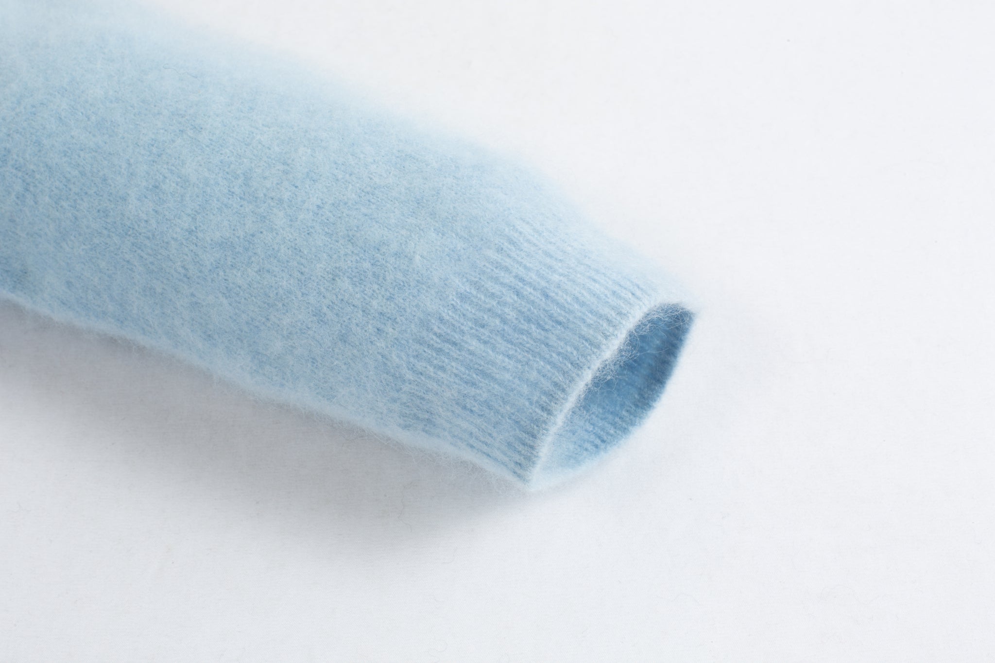 Merra Muse luxe cashmere crew cardigan with a refined, classic silhouette
