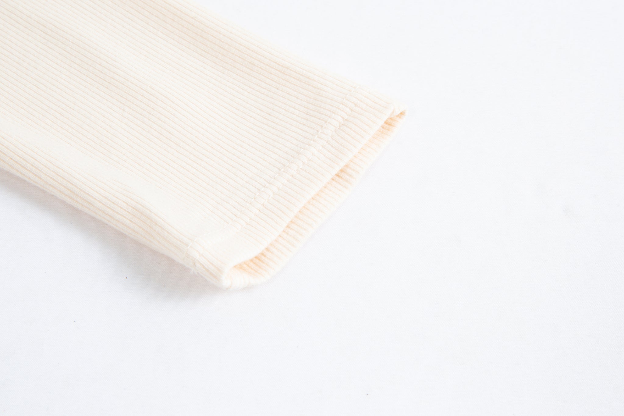 Merra Muse cutout long sleeve top styled with tailored trousers for a refined look
