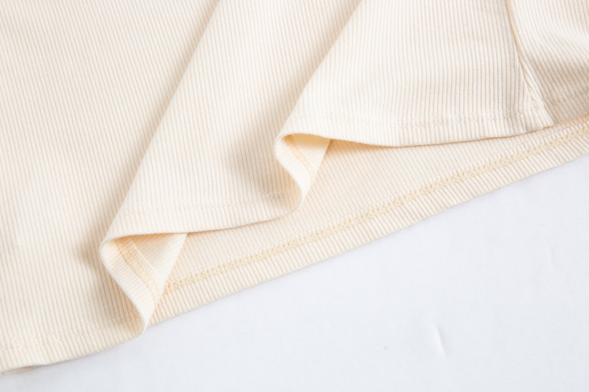 Merra Muse cutout long sleeve top styled with tailored trousers for a refined look
