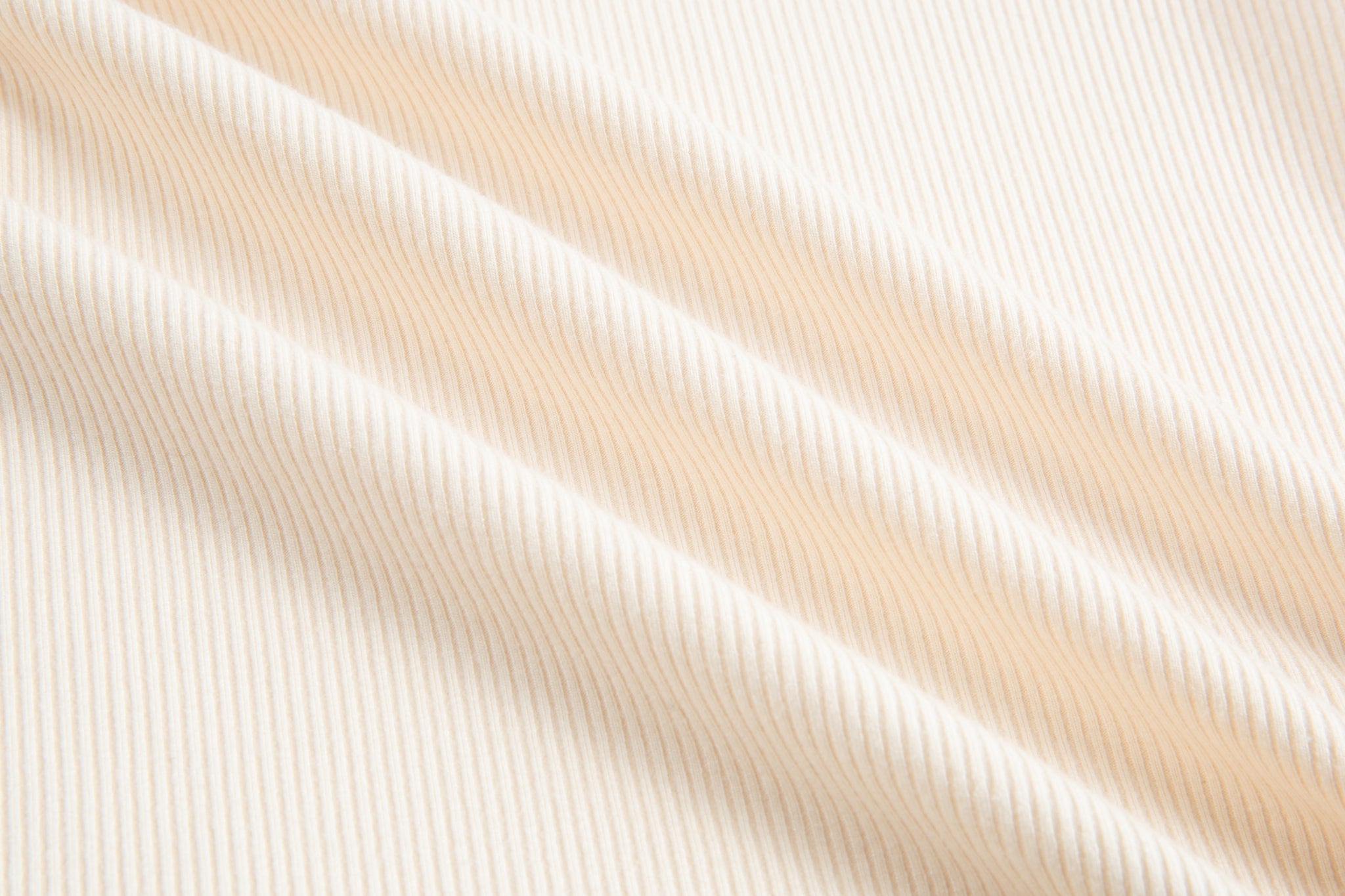 Merra Muse cutout long sleeve top styled with tailored trousers for a refined look
