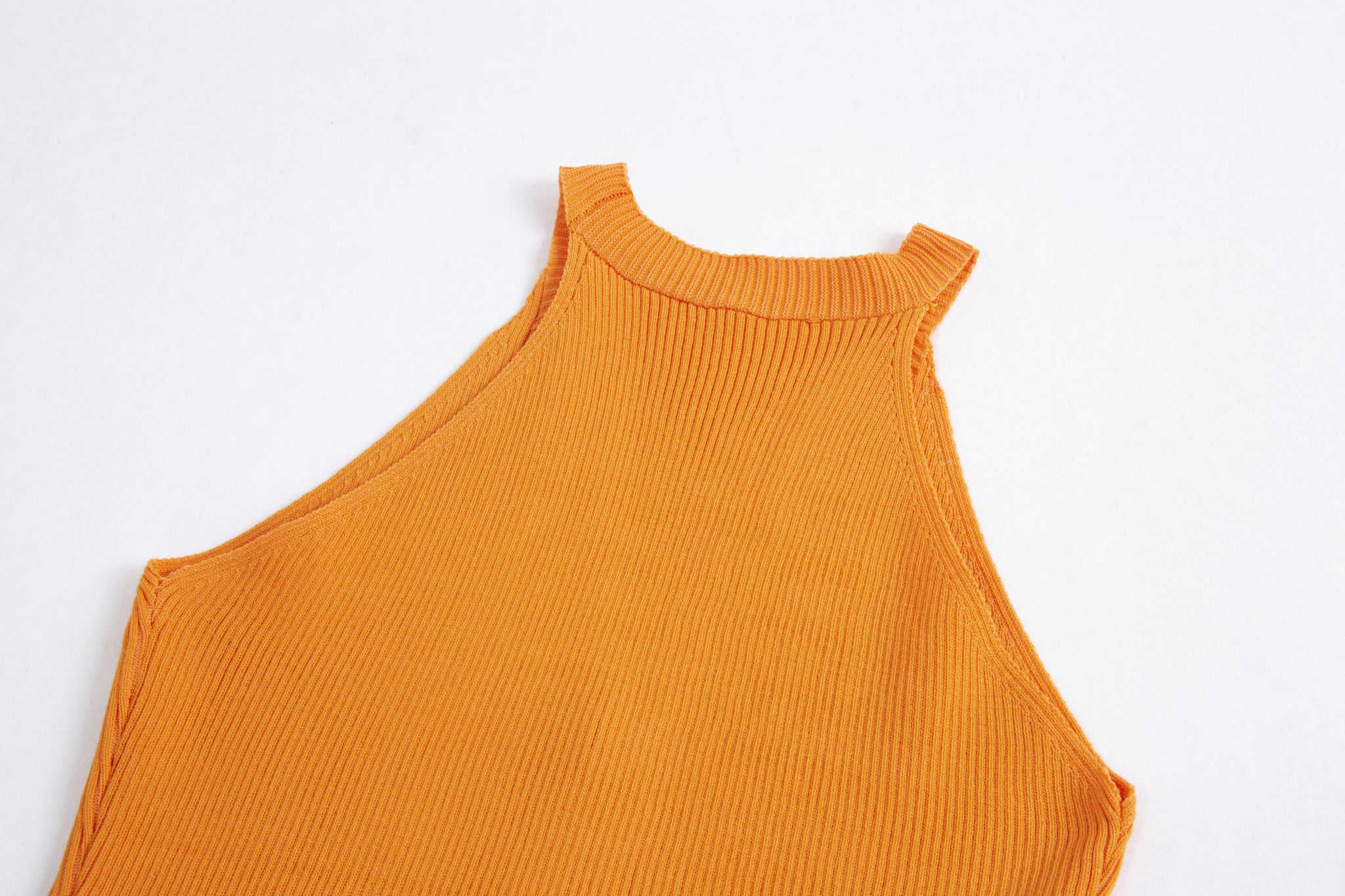 Merra Muse halter V-neck ribbed button tank with a fitted silhouette
