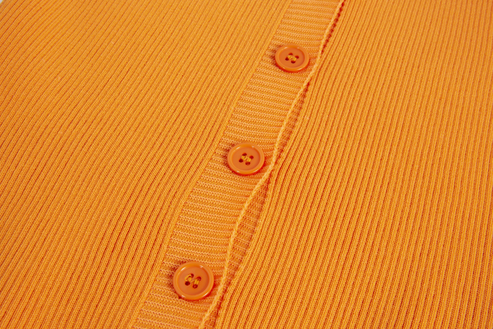 Merra Muse halter V-neck ribbed button tank with a fitted silhouette 
