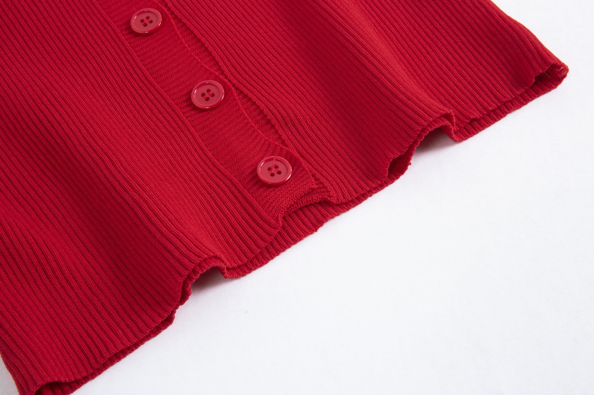 Merra Muse halter V-neck ribbed button tank with a fitted silhouette 
