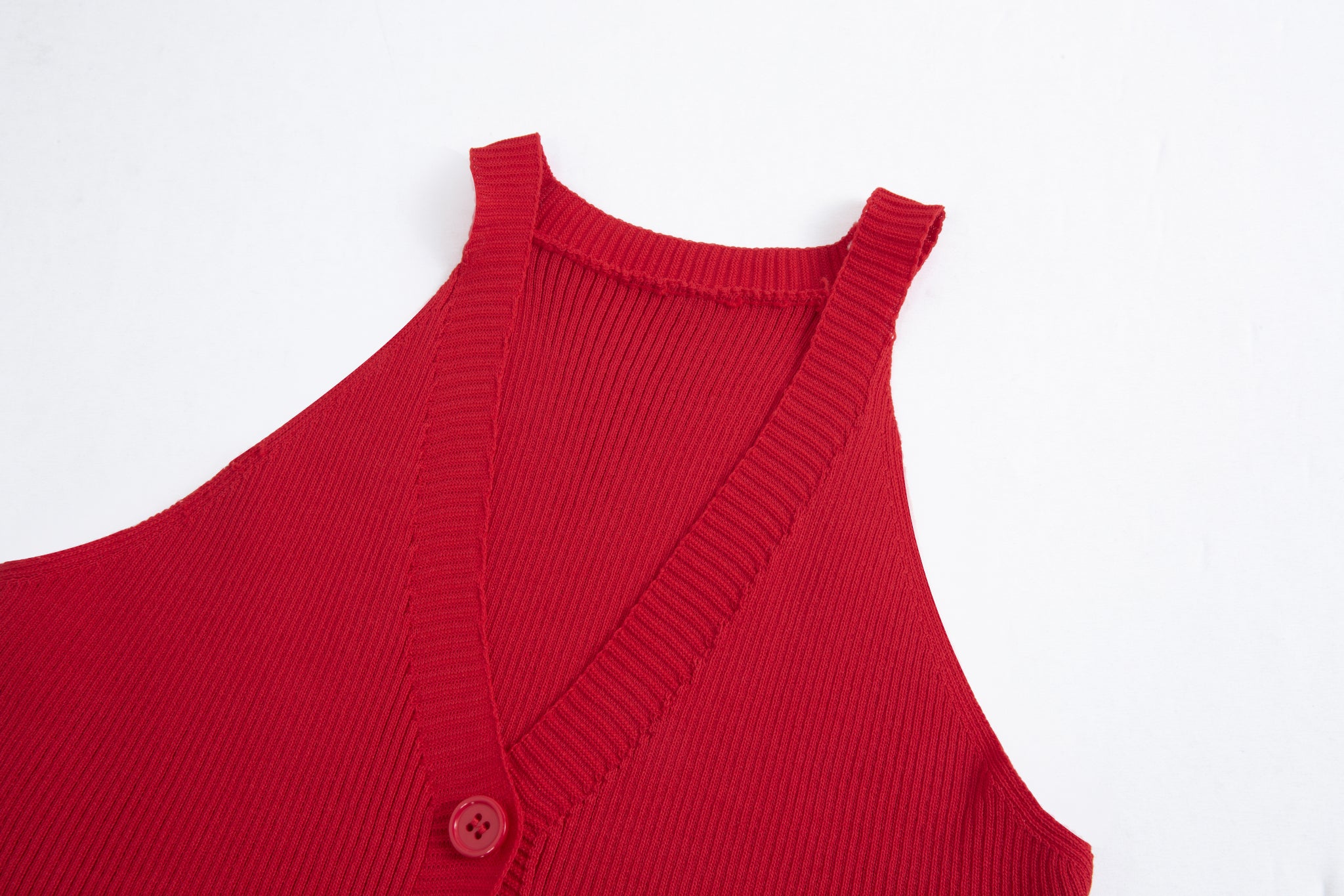 Merra Muse halter V-neck ribbed button tank with a fitted silhouette 
