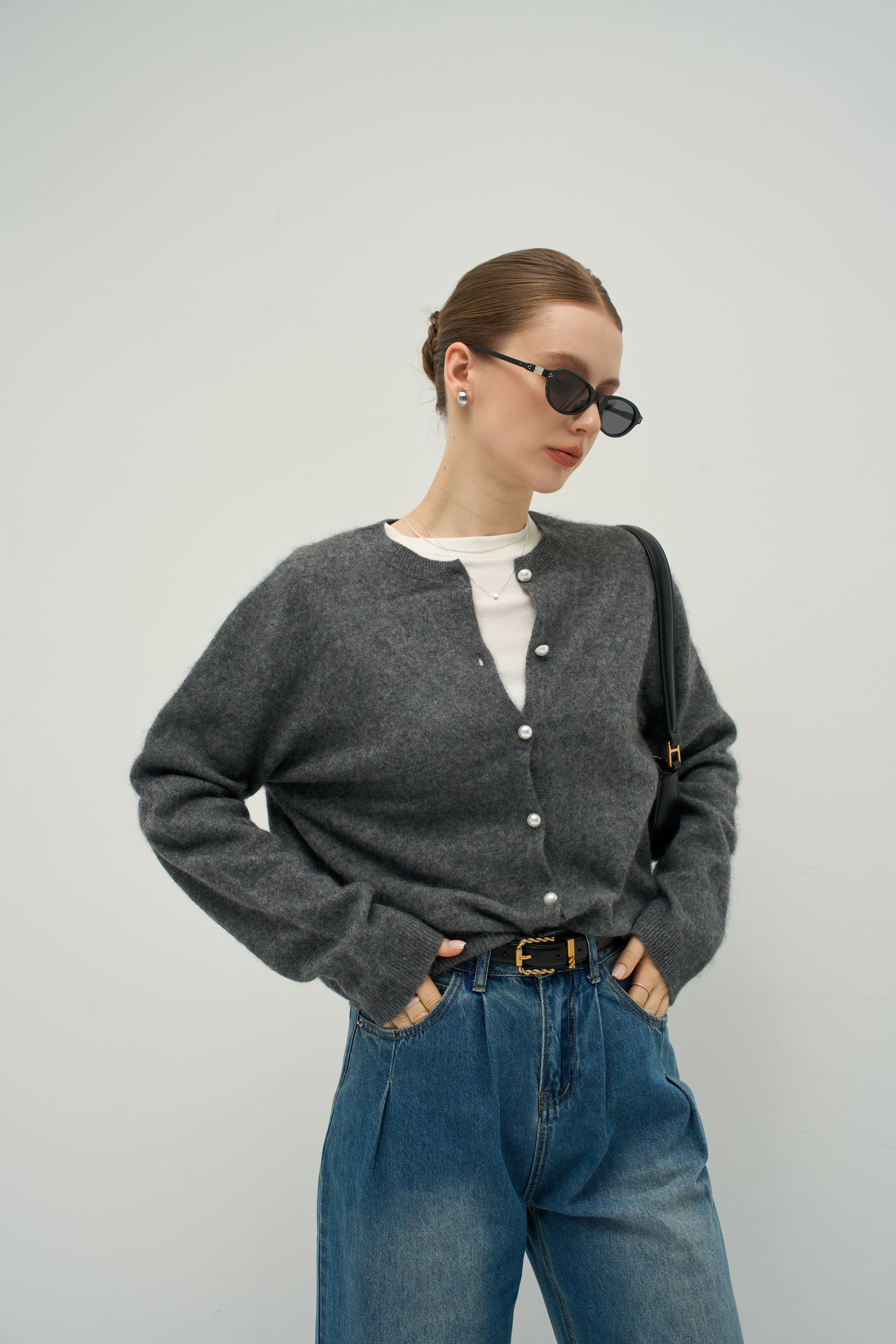 The Merra Muse Luxe Cashmere Crew Cardigan features a soft cashmere knit and timeless crew neckline—designed for refined, effortless layering.
