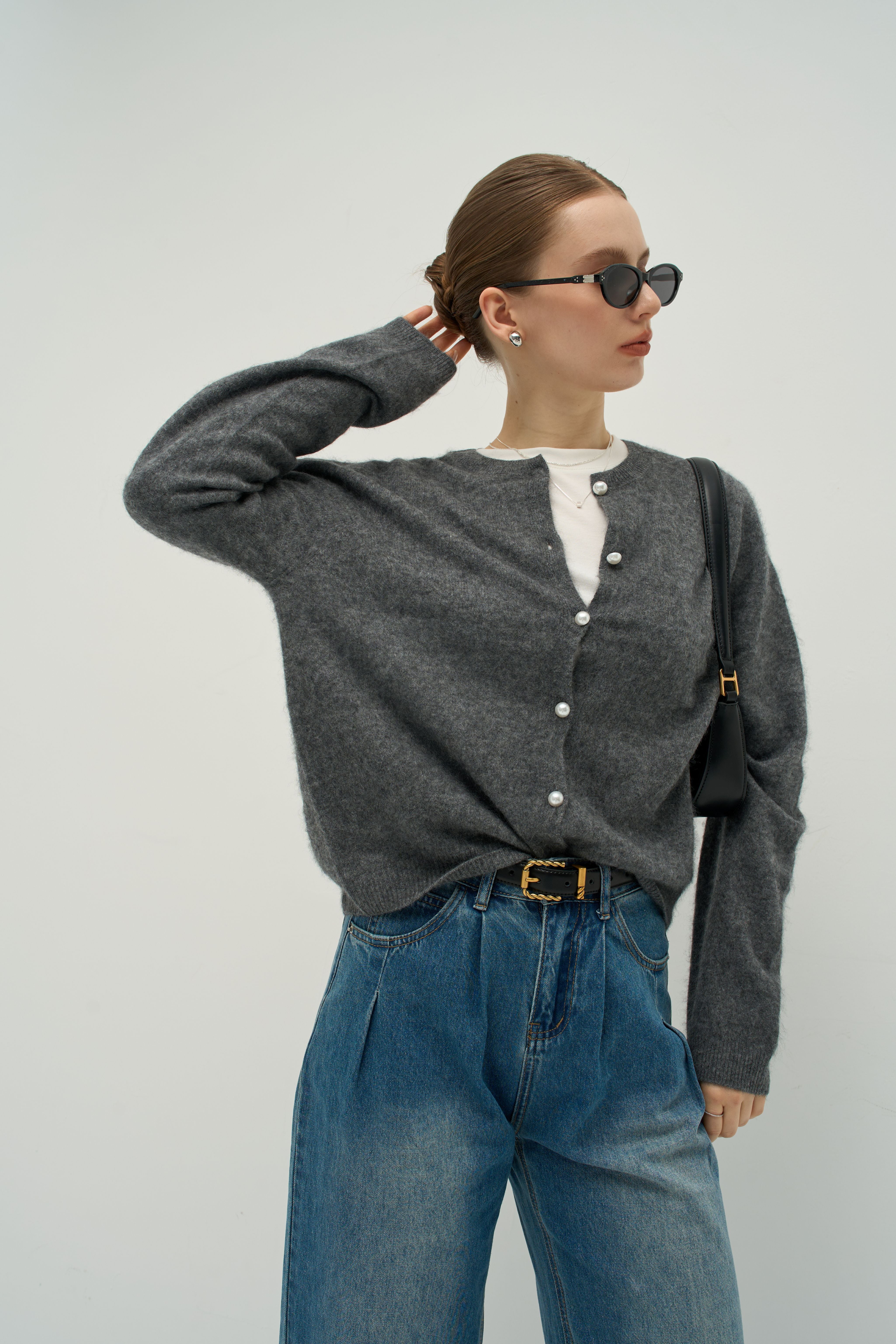 The Merra Muse Luxe Cashmere Crew Cardigan features a soft cashmere knit and timeless crew neckline—designed for refined, effortless layering.
