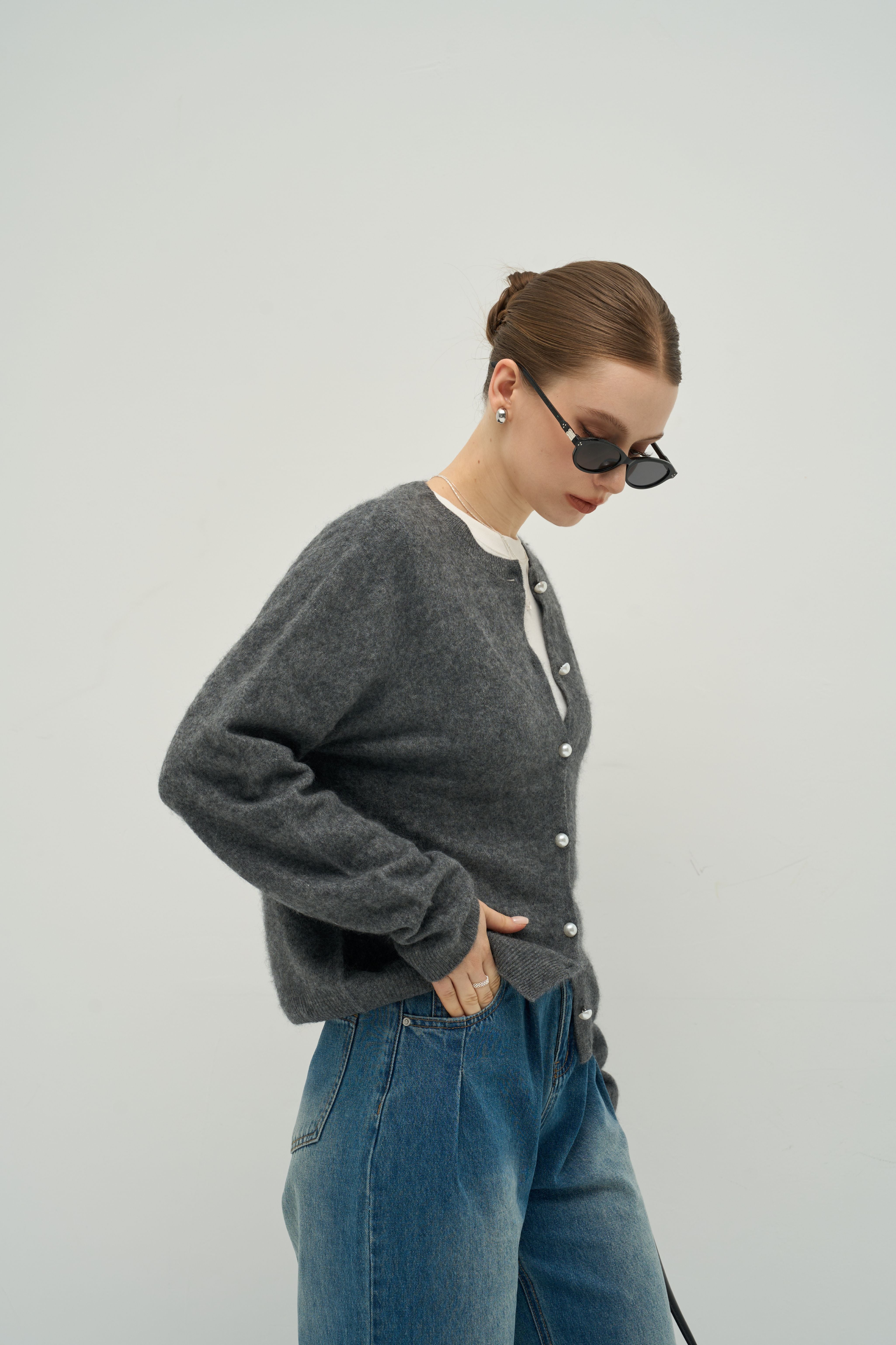 The Merra Muse Luxe Cashmere Crew Cardigan features a soft cashmere knit and timeless crew neckline—designed for refined, effortless layering.
