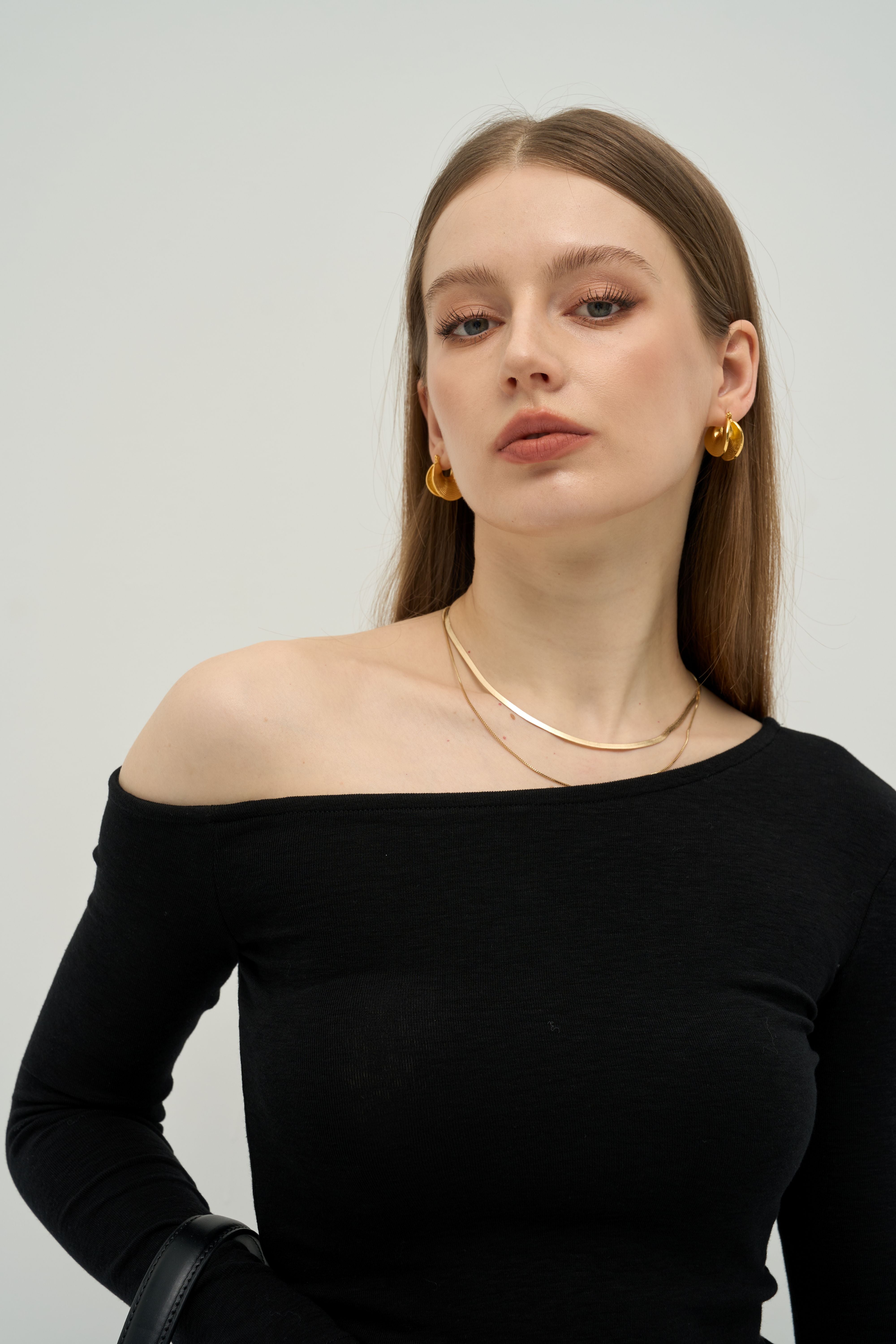 The Sculpted Asymmetrical Off-Shoulder Top